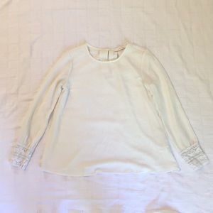 Off white long sleeve blouse with lace cuffs